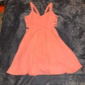 Pink sundress with side cutout details